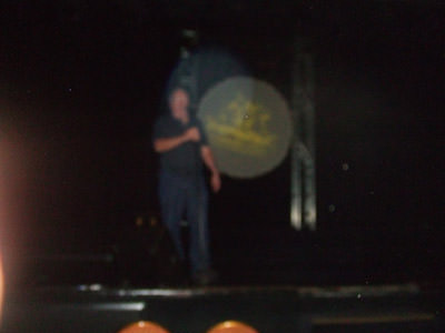 A blurry Bob Haig on stage
